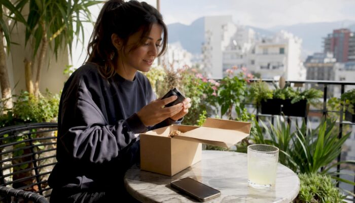 Woman unboxing legal cannabis delivery